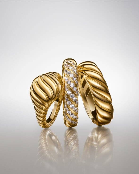 Three David Yurman Sculpted Cable rings for women.