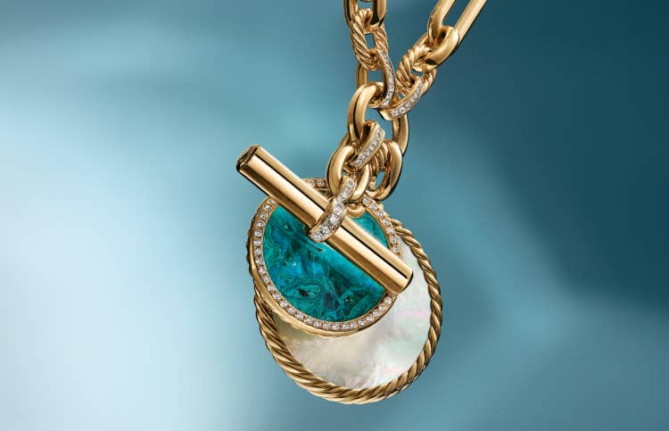 DY Elements amulets on a gold Lexington chain necklace.