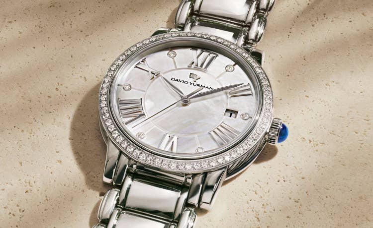 An image of a womens stainless steel watch with diamonds.