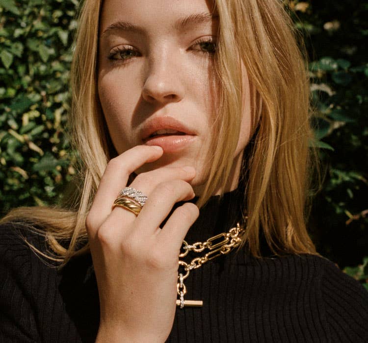 An image of Lila Moss wearing lexington necklace and band rings.