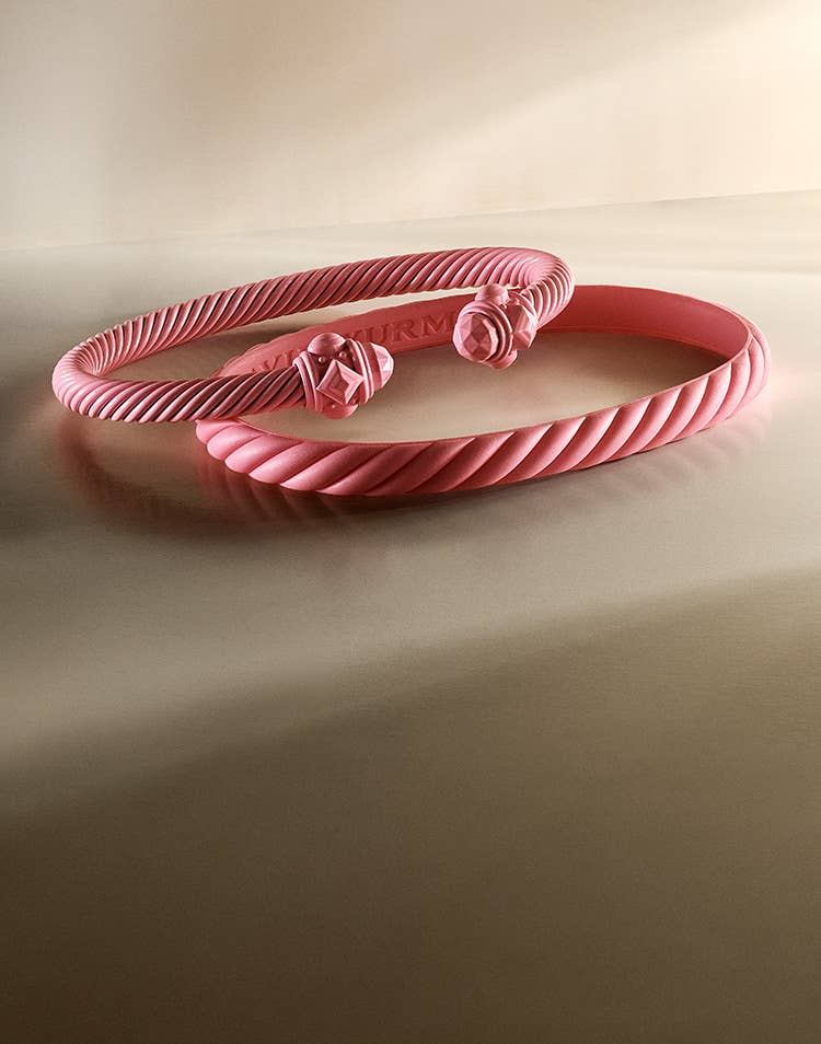 An image of the pink rubber bracelet and pink aluminum bracelet.