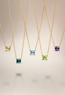 Five David Yurman Chatelaine amulets on chains.