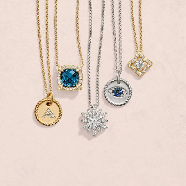 Five David Yurman necklaces with pendants.