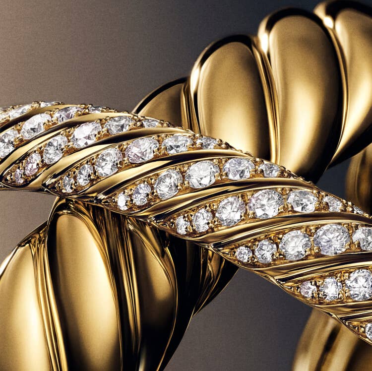 Two David Yurman Sculpted Cable gold bracelets details. 