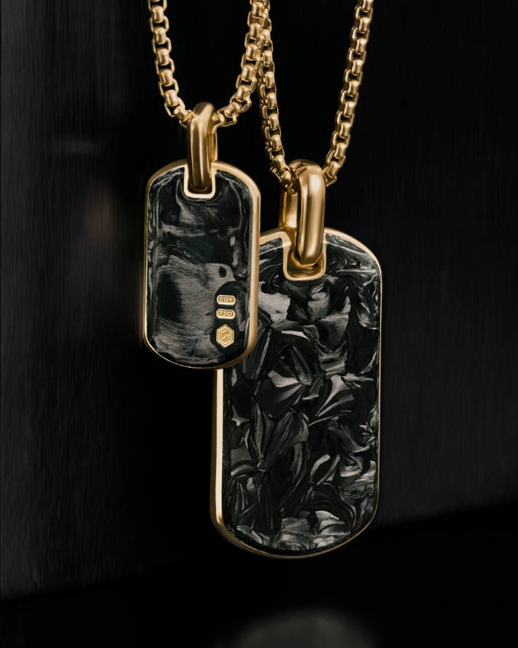 Two David Yurman Forged Carbon tags.