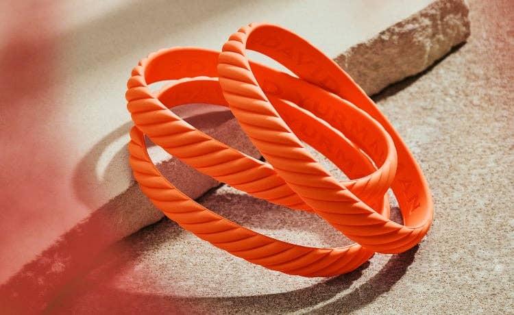 Shop the orange rubber bracelet to support the Trevor project.