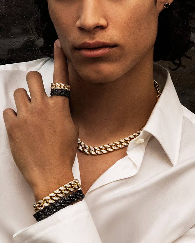 Model Wearing A Mix of David Yurman Gold and Silver Bracelet Cuffs