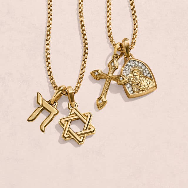 A variety of David Yurman pendants featuring religious symbols.