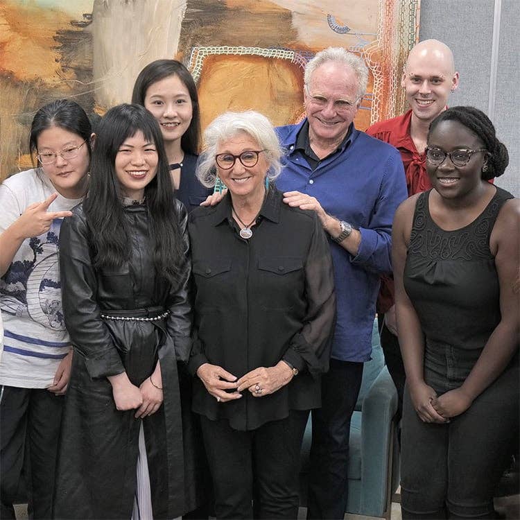 An image of David and Sybil Yurman with students from SCAD.