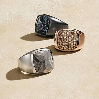 Three David Yurman signet rings. One silver, one rose gold and one blackened silver.
