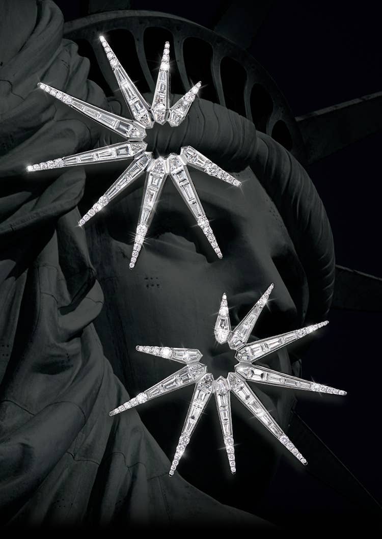 An image of liberty earrings in white gold with diamonds.