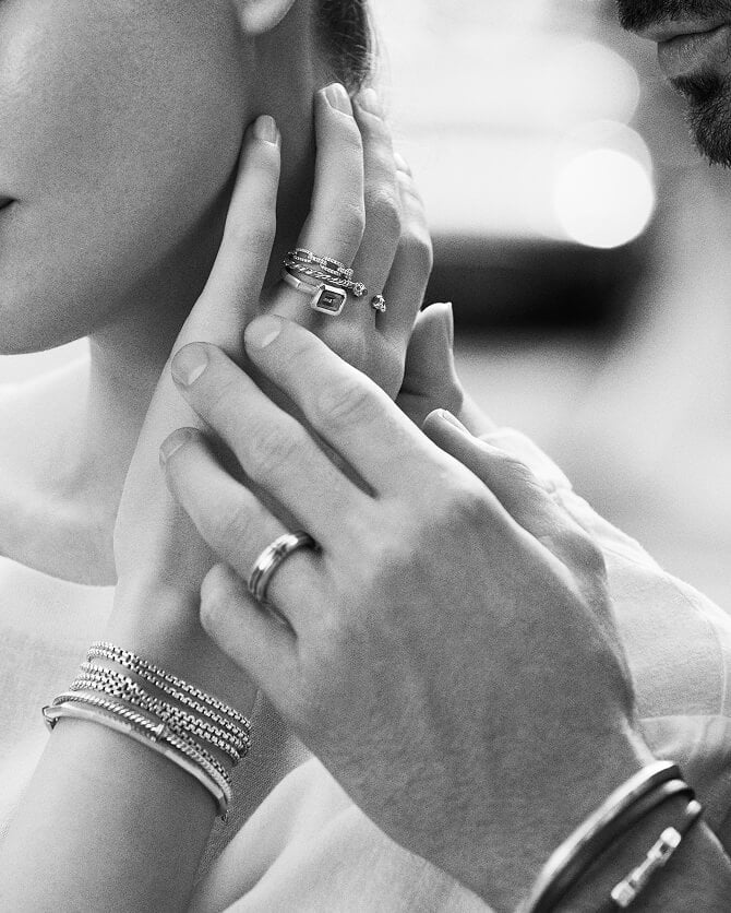 Close up of a couple wearing David Yurman jewelry.