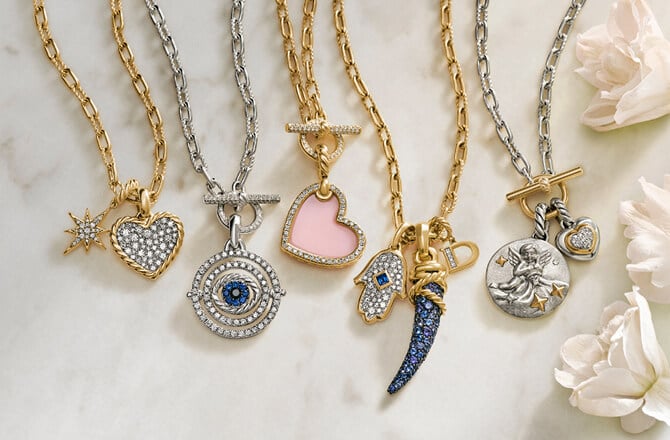 Various David Yurman charms on chains.