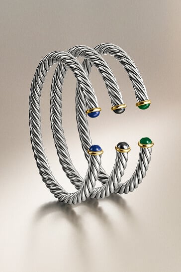 Three David Yurman men's cable bracelets.