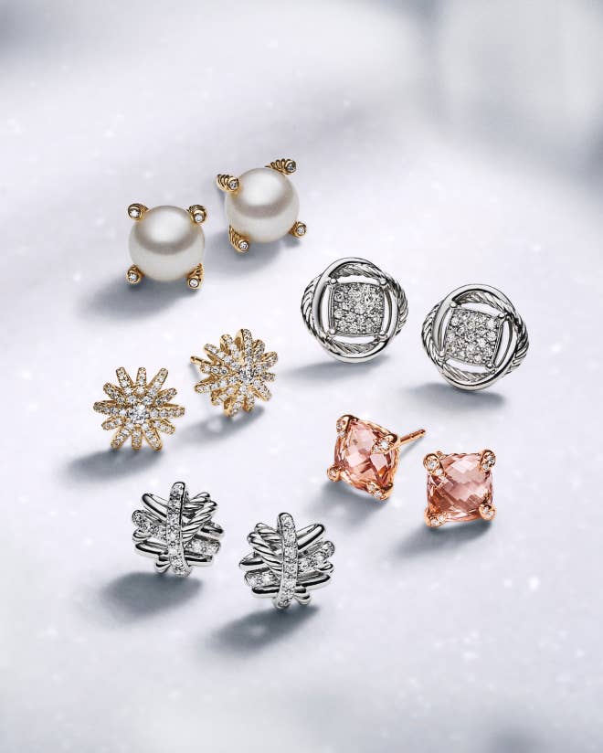 A variety of David Yurman stud earrings with pearls, stones and a variety of metals.