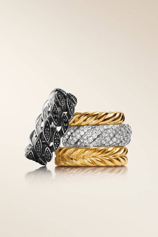 A stack of four David Yurman rings. 