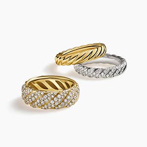 Three David Yurman band rings with and without stones.