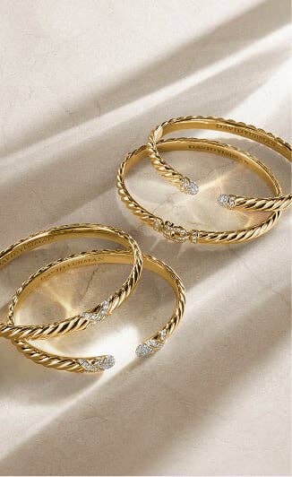 Four classic David Yurman bracelets.