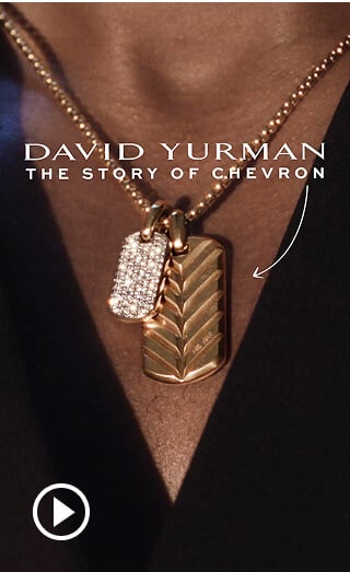 A close up of Michael B. Jordan wearing Chevron jewelry.