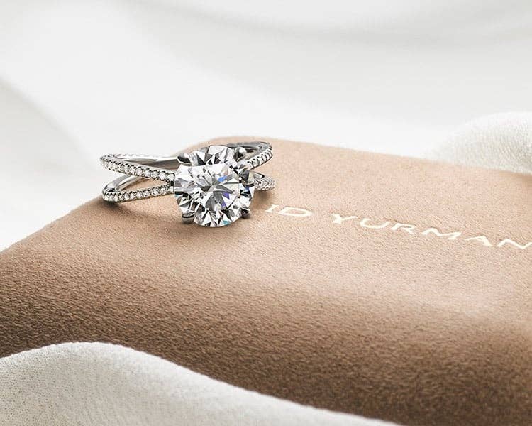 David Yurman Diamond Ring on tan packaging.