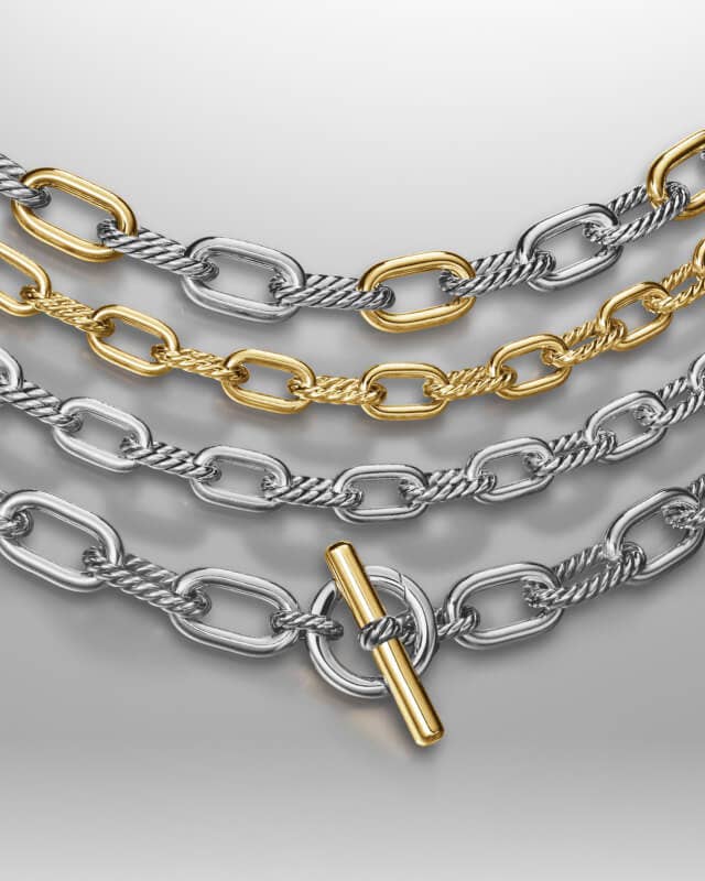 Four David Yurman chains in gold and silver.