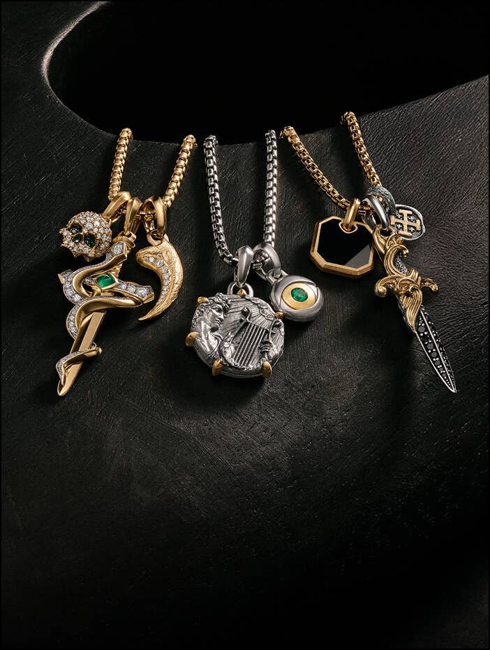 A selection of David Yurman chains with amulets and pendants.