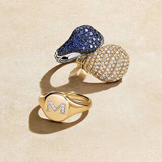 Three David Yurman pinky rings in color and silver.