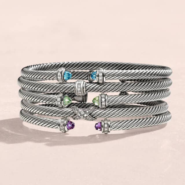 Two David Yurman Sculpted Cable Cuff Bracelets in Sterling Silver.
