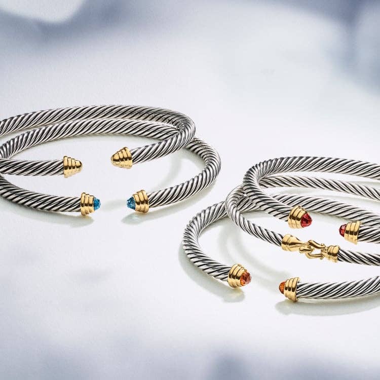 An image of five David Yurman bracelets.