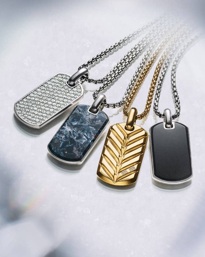 A variety of David Yurman tag pendants and chains.