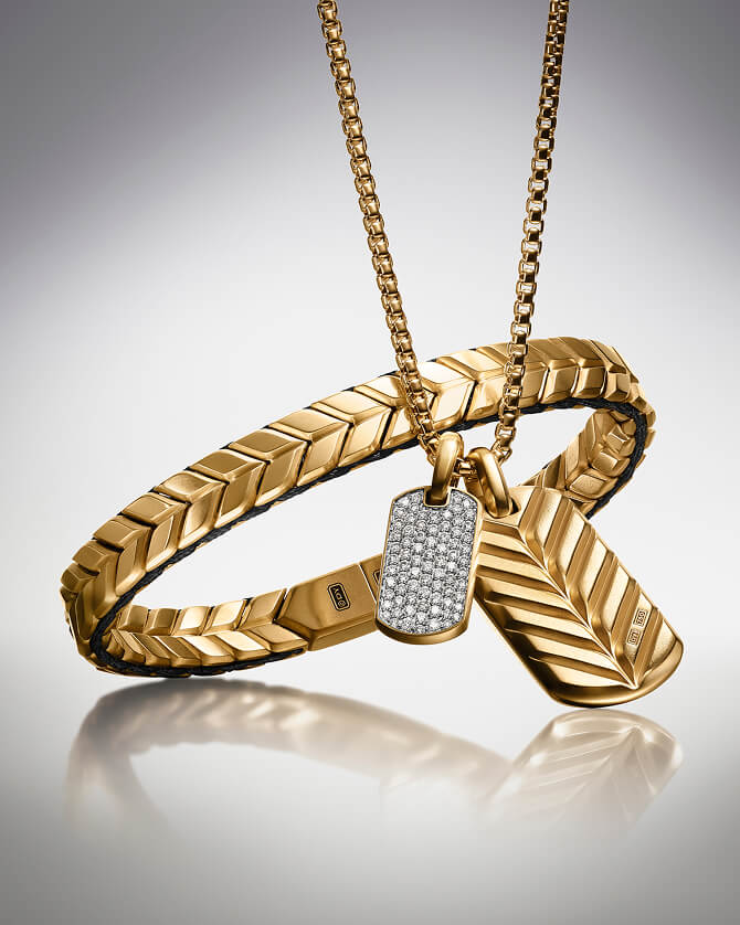 A David Yurman Chevron bracelet next to two tags.