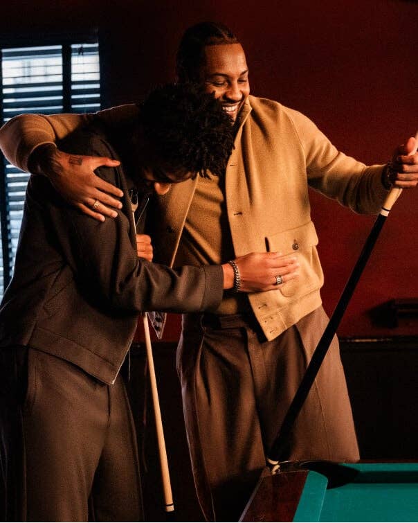 Carmelo Anthony playing pool with his son.