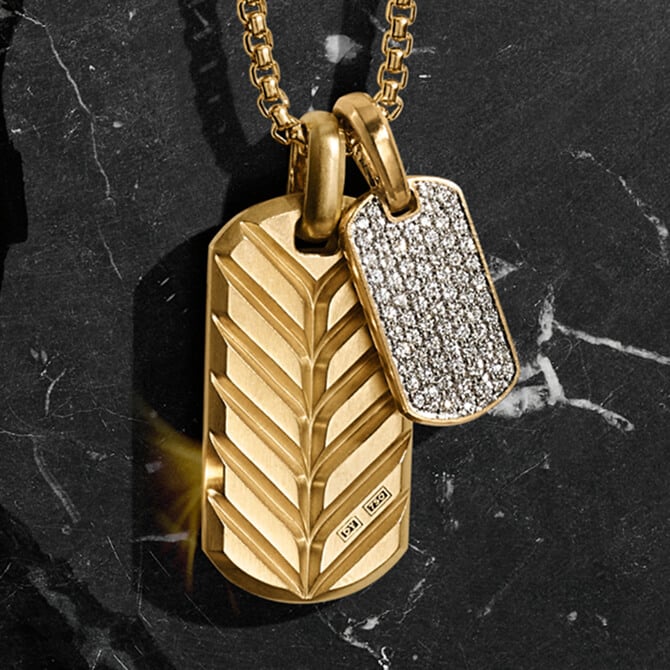 Two David Yurman Chevron tags in gold and diamond pave on a chain.