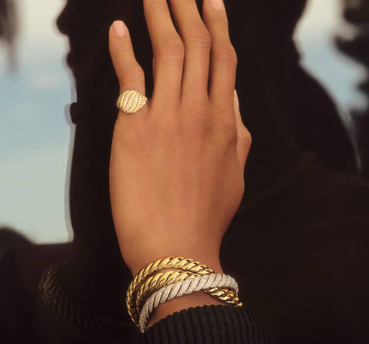 An image of Sydney wearing yellow gold Sculpted Cable.