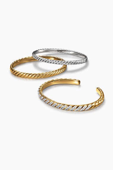 Three David Yurman bracelets.