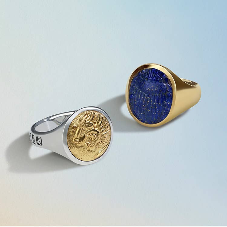 An image of two mens Petrvs rings. One with silver and gold the other in yellow gold with lapis.