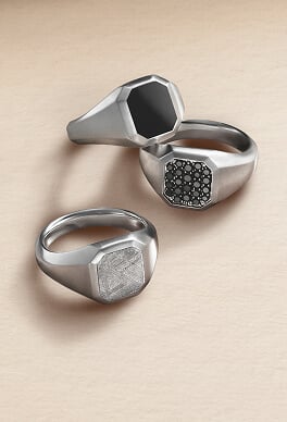 Three David Yurman signet rings.