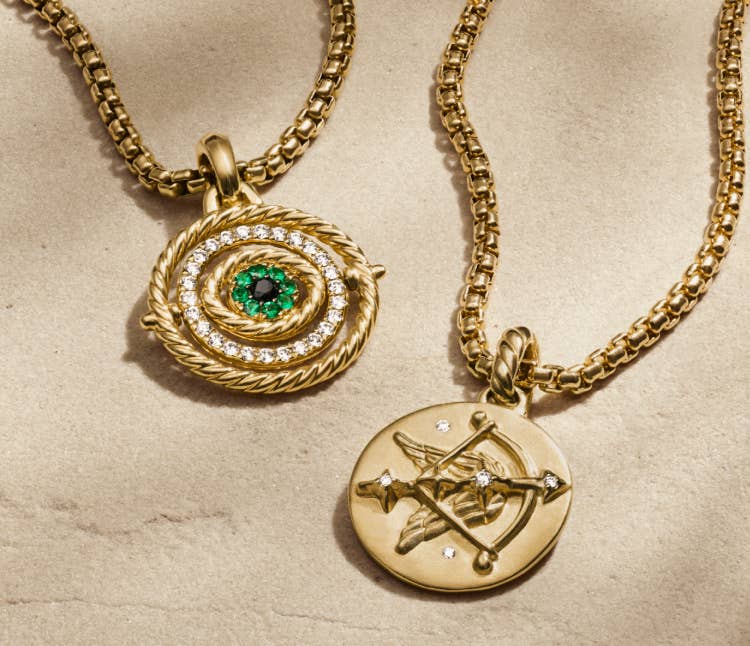 An image of two gold amulets.