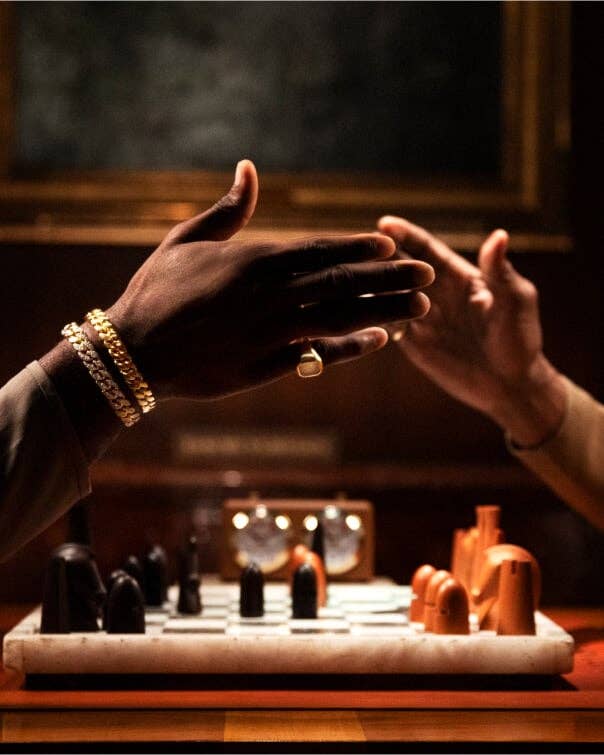 Two hands with David Yurman jewelry on them.
