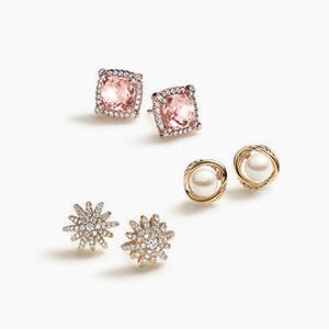 Three pairs of David Yurman stud earrings with and pearls and stones.