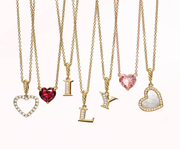 An image of seven gold necklaces.