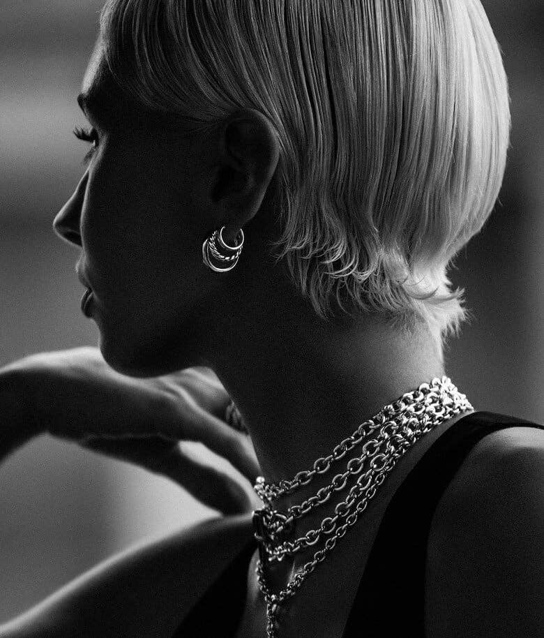 Iris Law wearing David Yurman earrings and necklaces.