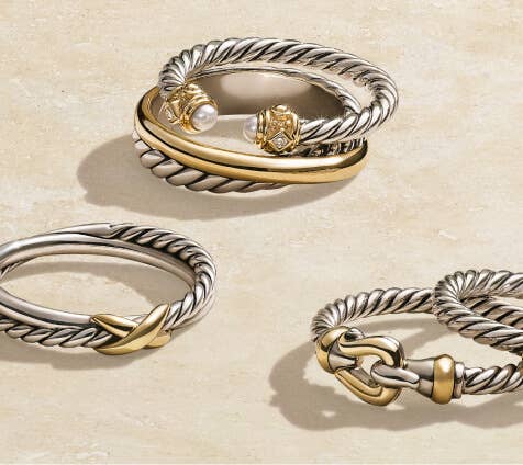 A collection of 6 David Yurman cable rings.
