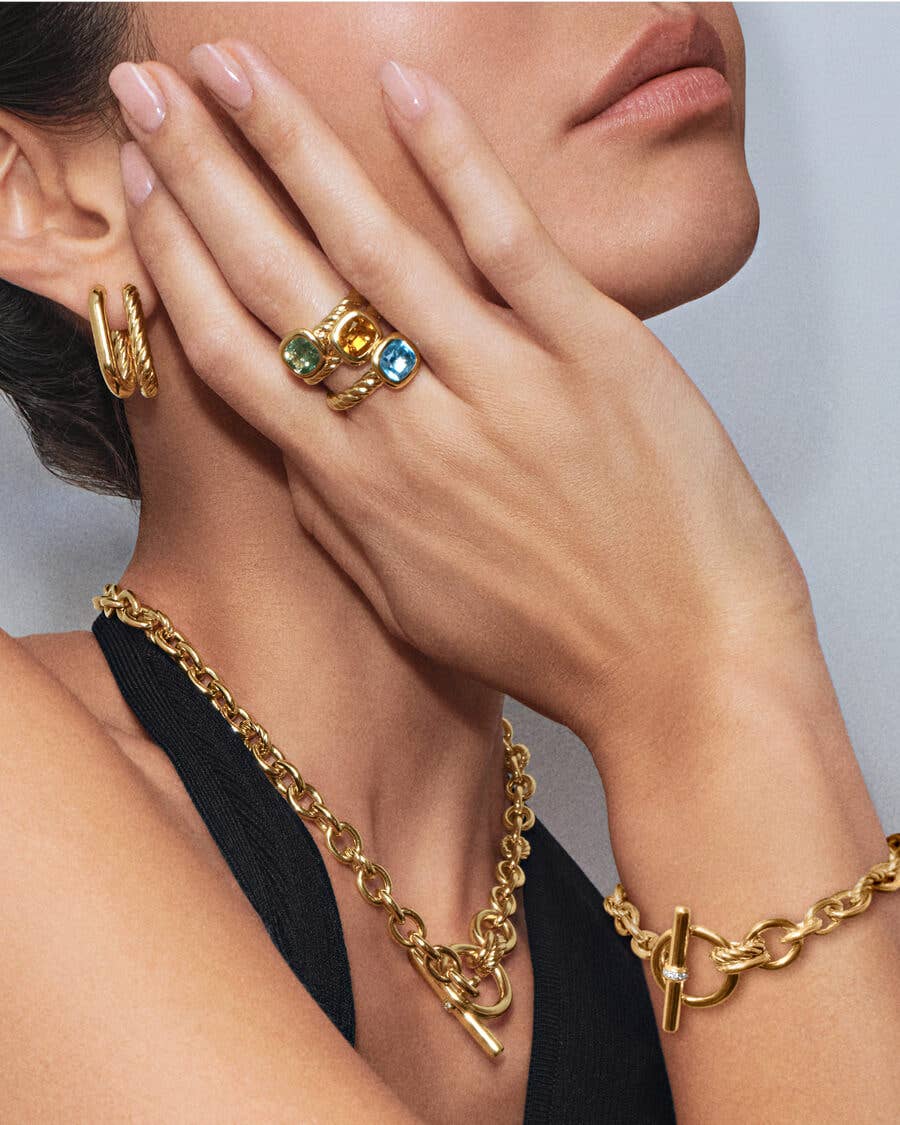 Close up of DY Mercer® collection featuring necklace, bracelets, rings, and earrings.