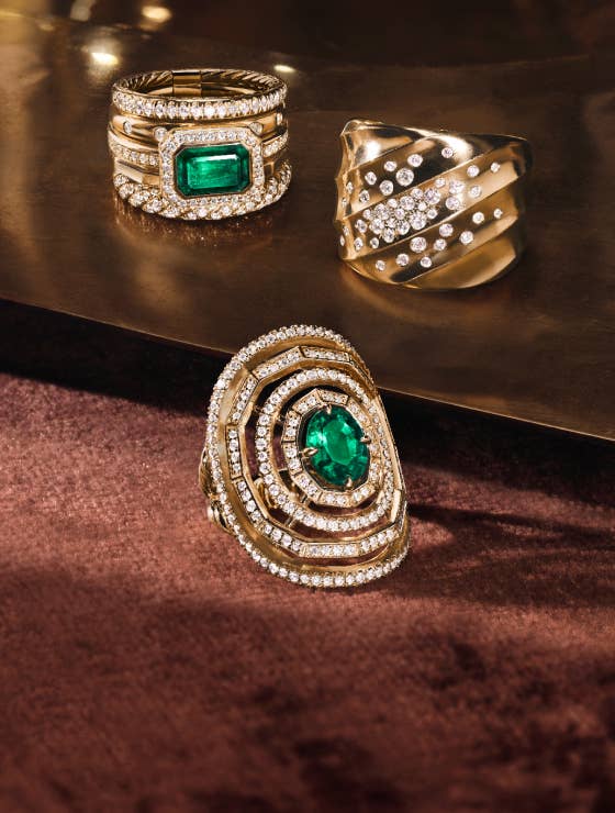 Gift Guide for her - Modern David Yurman gold rings with emerald and diamond stones.