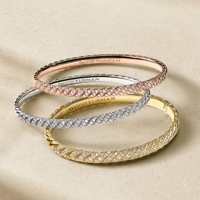 Three David Yurman bracelets for women.