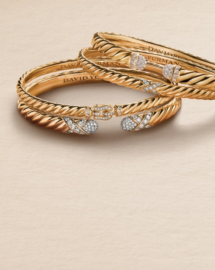 Four David Yurman cable bracelets.