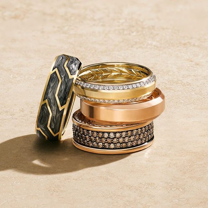 Four David Yurman rings for men stacked.