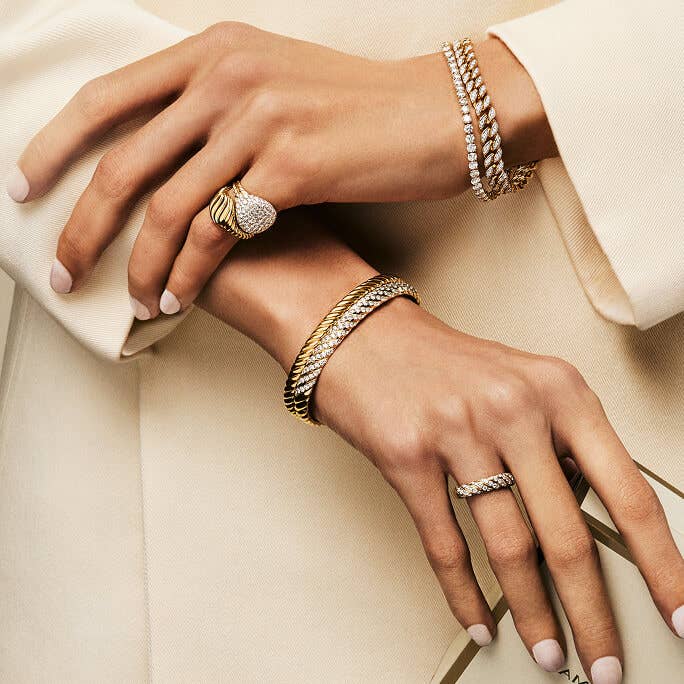 Close up of a model wearing David Yurman jewelry.