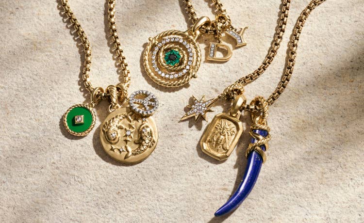 An image of 9 gold amulets for women.